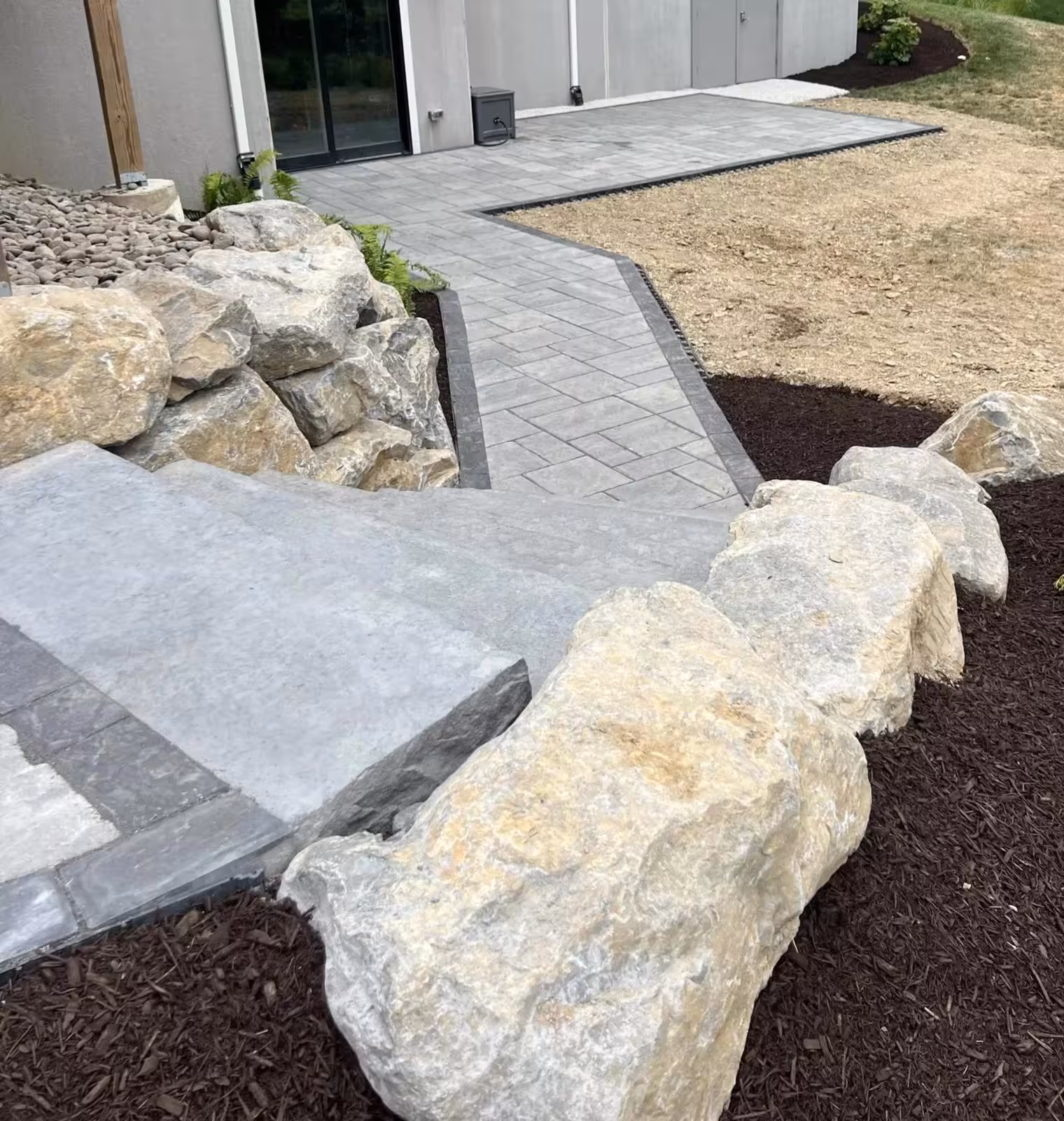 Completed landscape and hardscape project by Sombra's Landscaping